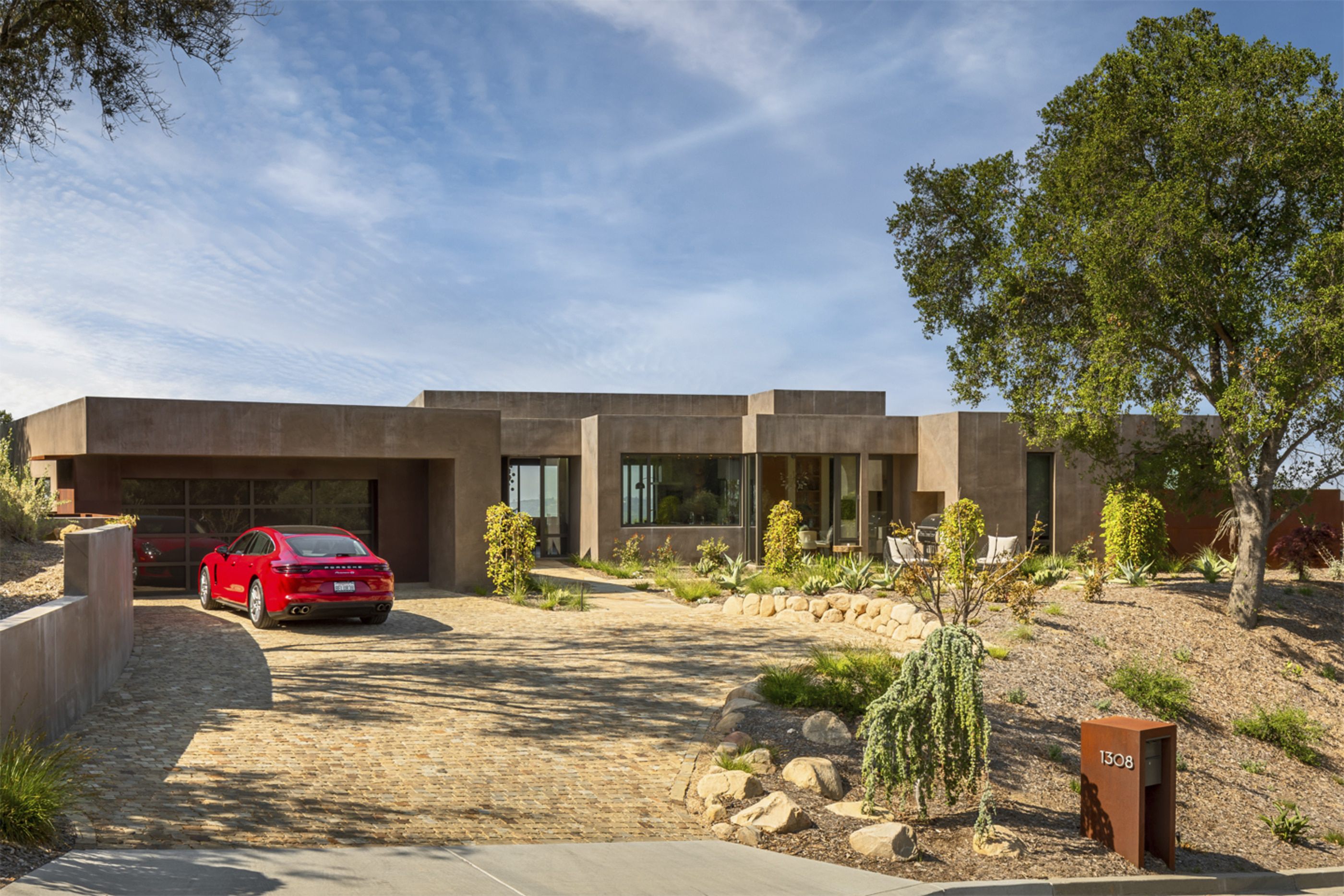 Cherry-Brook-Residence-Integrally-colored-plaster-Glass-Garage-Door