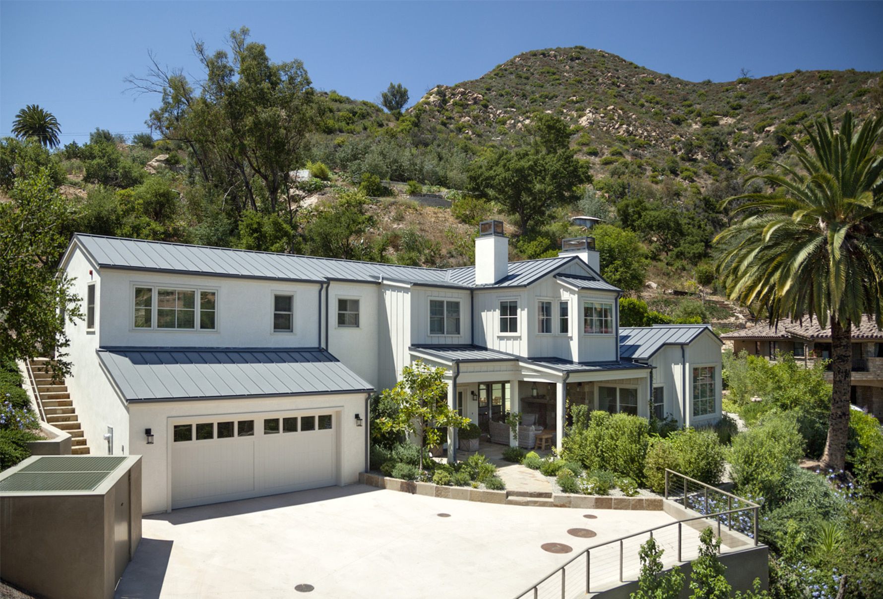 East-Mountain-Residence-Metal-Roof-Board-and-Batt-Wood-Siding